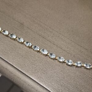 Elegant Gold Bracelet with Light Blue Stones